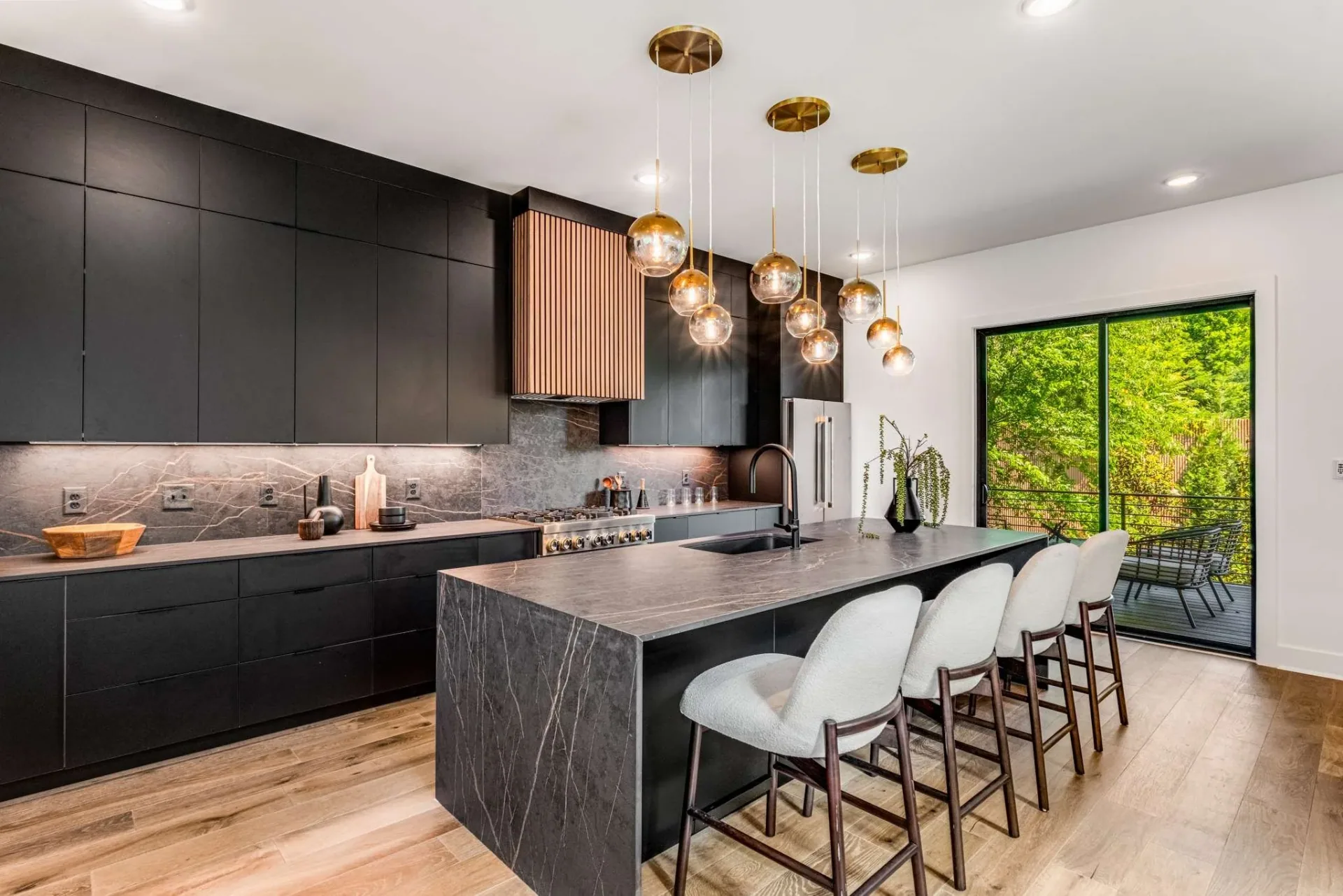 Dark cabinetry wrapping the Battlefield kitchen