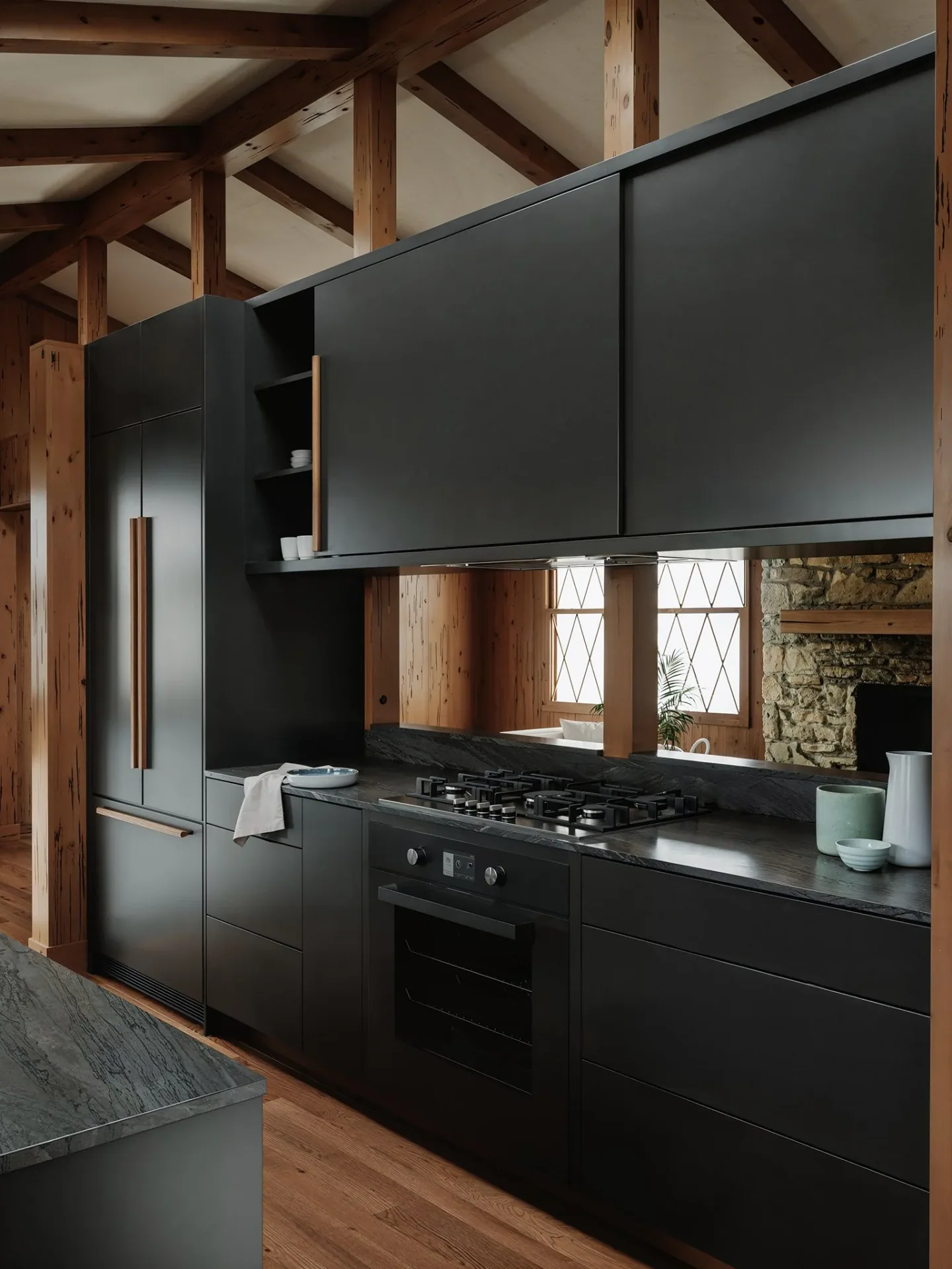 Tall dark cabinets surrounding the range at the Vanoke project