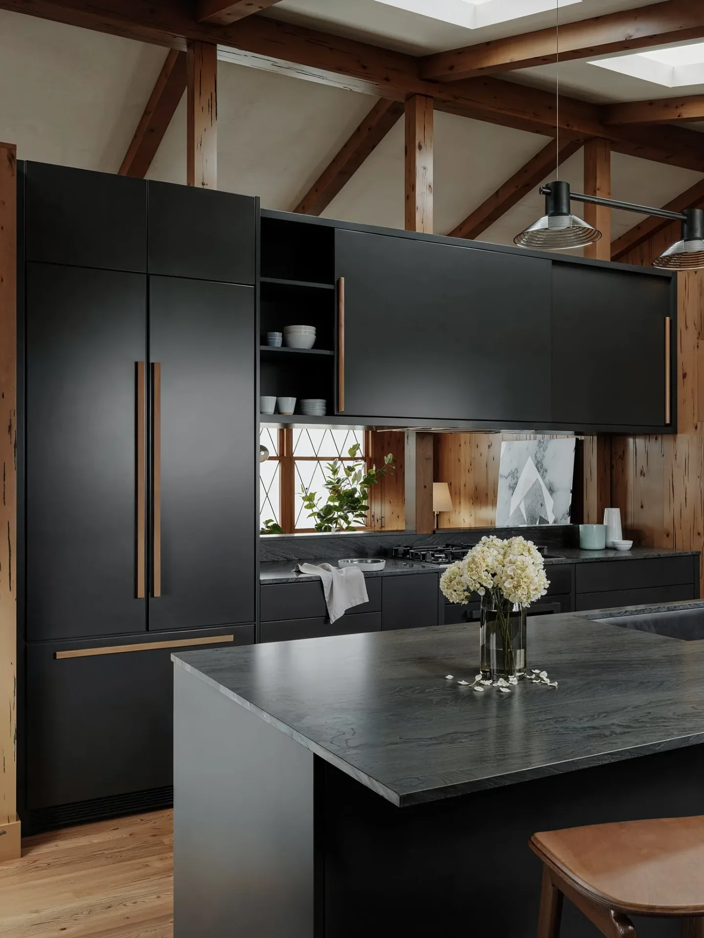 Dark Vanoke kitchen island and integrated cabinet wall