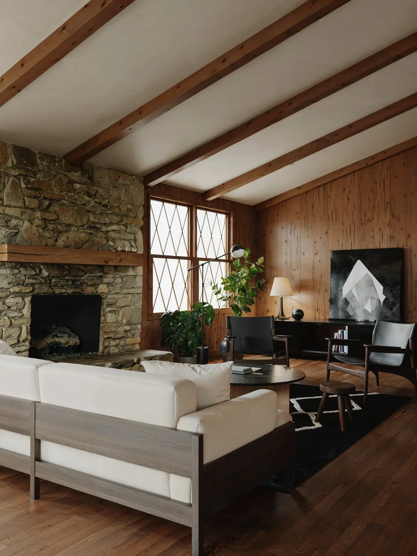 Wood-lined Vanoke living room beside the kitchen